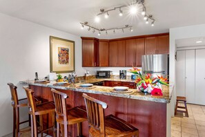 Condo, Multiple Beds, Lanai, Ocean View (Kona Pacific D524 Kauhale) | Private kitchen | Dining tables