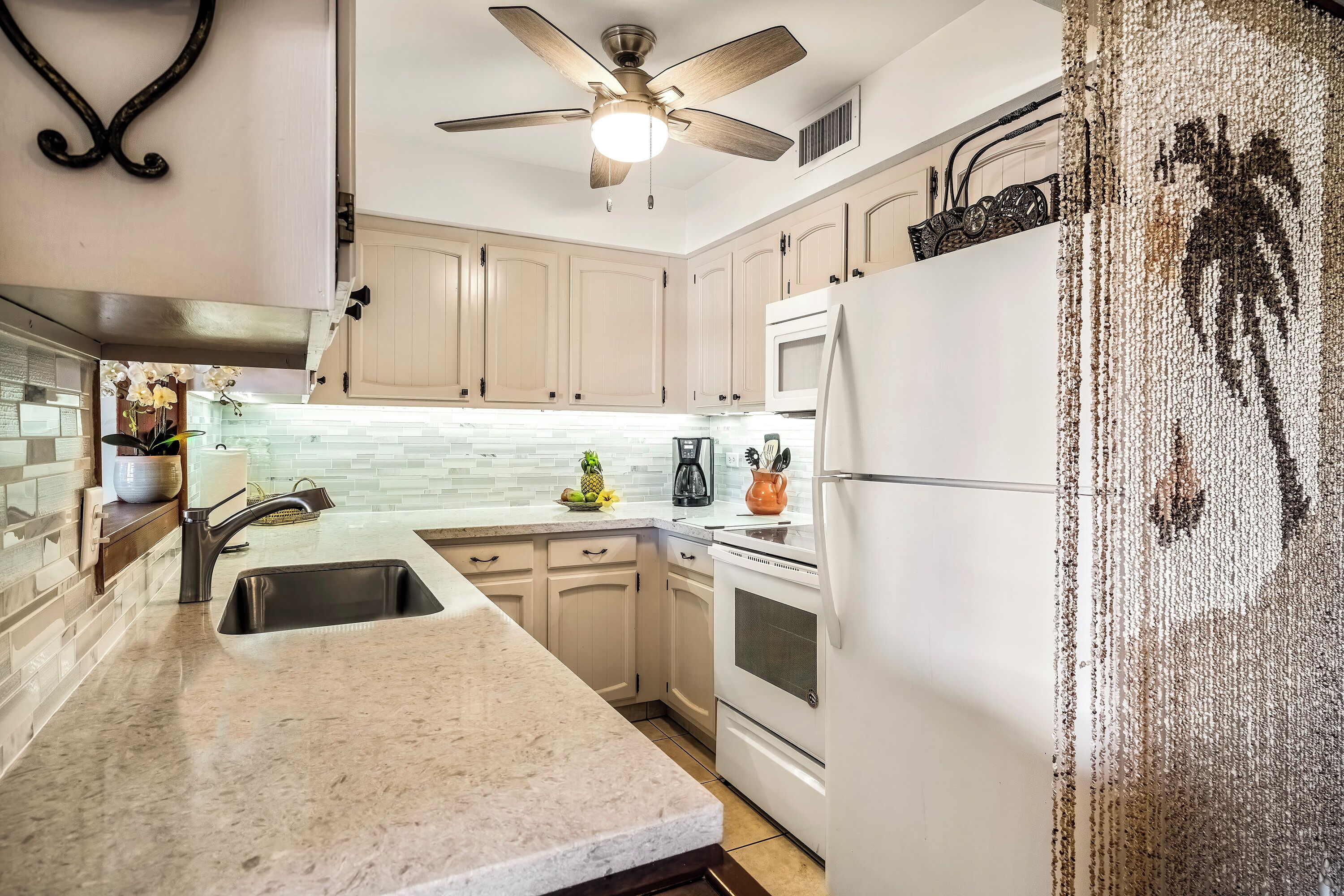 Condo, 1 Queen Bed with Sofa bed, Lanai, Partial Ocean View (Casa de Emdeko 310) | Private kitchen | Dining tables