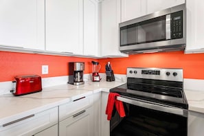 Condo, Multiple Beds, Lanai, Ocean View (Sea Village 2106) | Private kitchen | Coffee/tea maker, dining tables