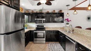 Condo, Multiple Beds, Lanai, Ocean View (Country Club Villas 341) | Private kitchen | Dining tables