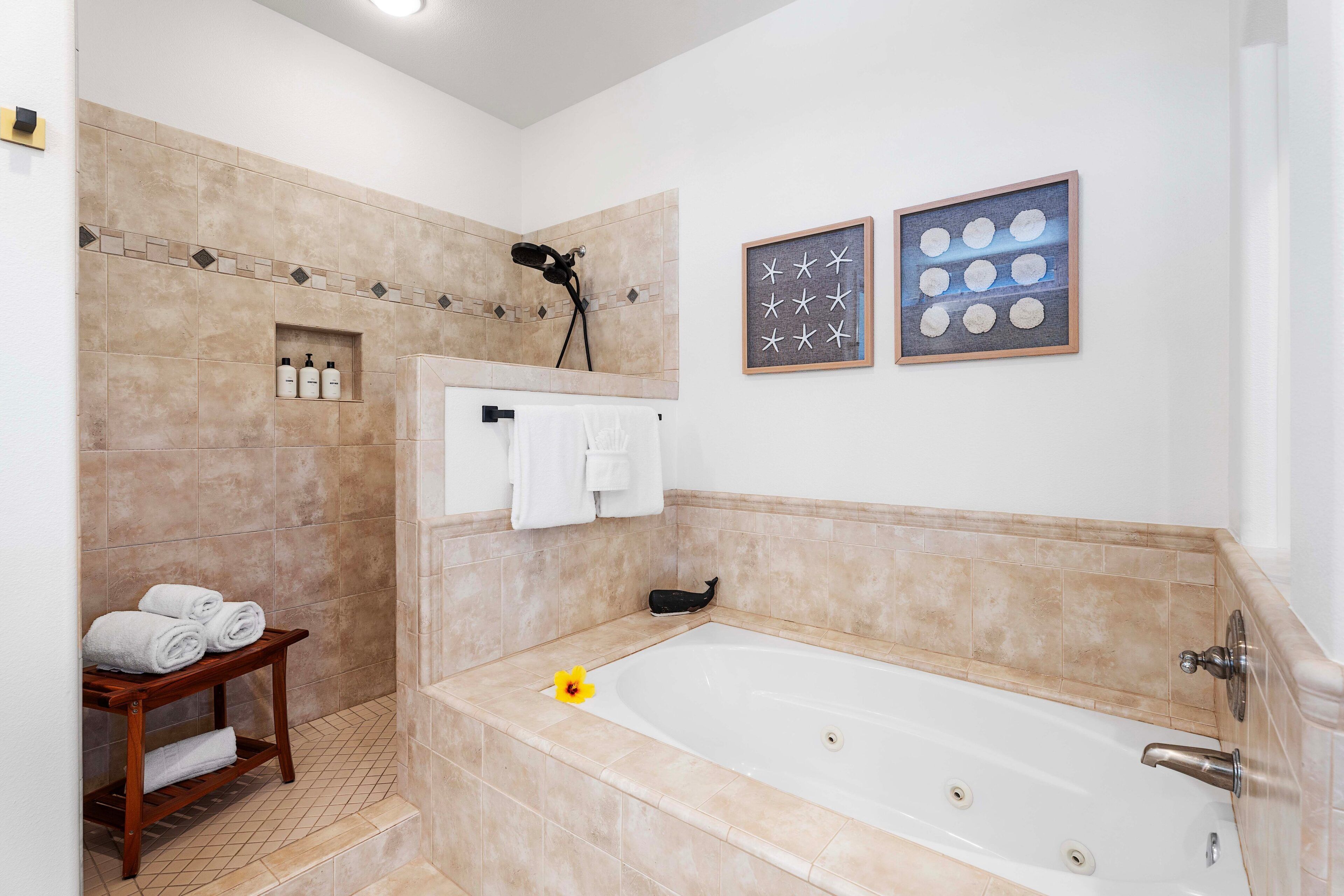 A bathroom with a bathtub, a shower, and a towel rack.