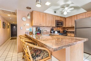 Condo, 1 King Bed, Lanai, Partial Ocean View (Casa de Emdeko 232) | Private kitchen | Dining tables