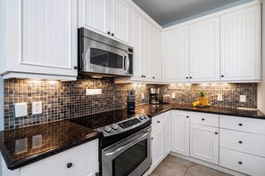 Townhome, Multiple Beds, Lanai, Garden View (Kulalani at Mauna Lani 2301) | Private kitchen | Coffee/tea maker, dining tables