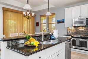 Townhome, Multiple Beds, Lanai, Garden View (Kulalani at Mauna Lani 2301) | Private kitchen | Coffee/tea maker, dining tables