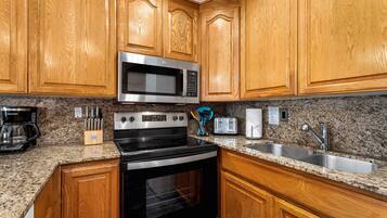 Condo, 1 King Bed with Sofa bed, Balcony, Partial Ocean View (Kona Isle B38) | Private kitchen | Dining tables