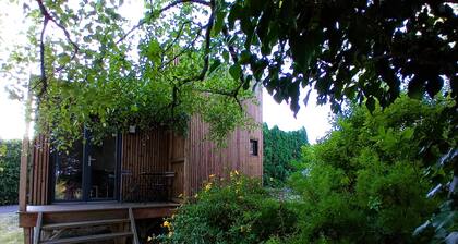 Chalet in the countryside, in the heart of a wooded garden.