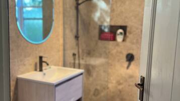 Shower, towels, soap, toilet paper