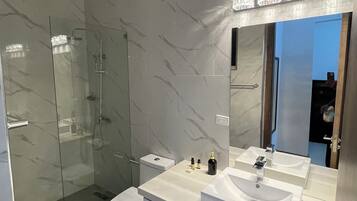 Shower, hair dryer, towels, soap