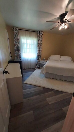 1 bedroom, desk, iron/ironing board, travel crib