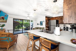 Condo, 1 King Bed with Sofa bed, Lanai, Garden View (Casa de Emdeko 114) | Private kitchen | Coffee/tea maker, dining tables