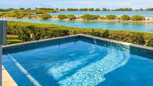 A swimming pool with a view of a coastal landscape. - Piece of Paradise located at Hawks Cay in Duck Key (Duck Key)