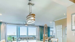 A modern kitchen with a central island, a large window offering a view, and a ceiling fan. - Piece of Paradise located at Hawks Cay in Duck Key (Duck Key)