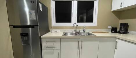 Fridge, microwave, stovetop, coffee/tea maker