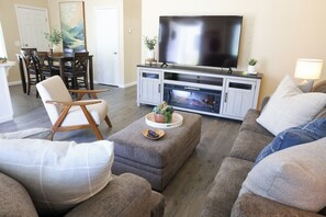 Smart TV, fireplace, books, music library