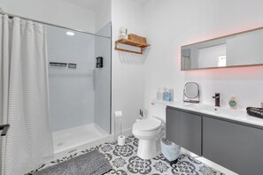 Shower, hair dryer, towels, soap