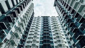 A high-rise residential building with multiple balconies and a modern architectural design. - Spacious & Relaxing Haven (Iloilo)