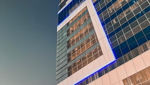 A high-rise building with a prominent KPMG logo on the facade. - The Halyard Apartments  (Cape Town)