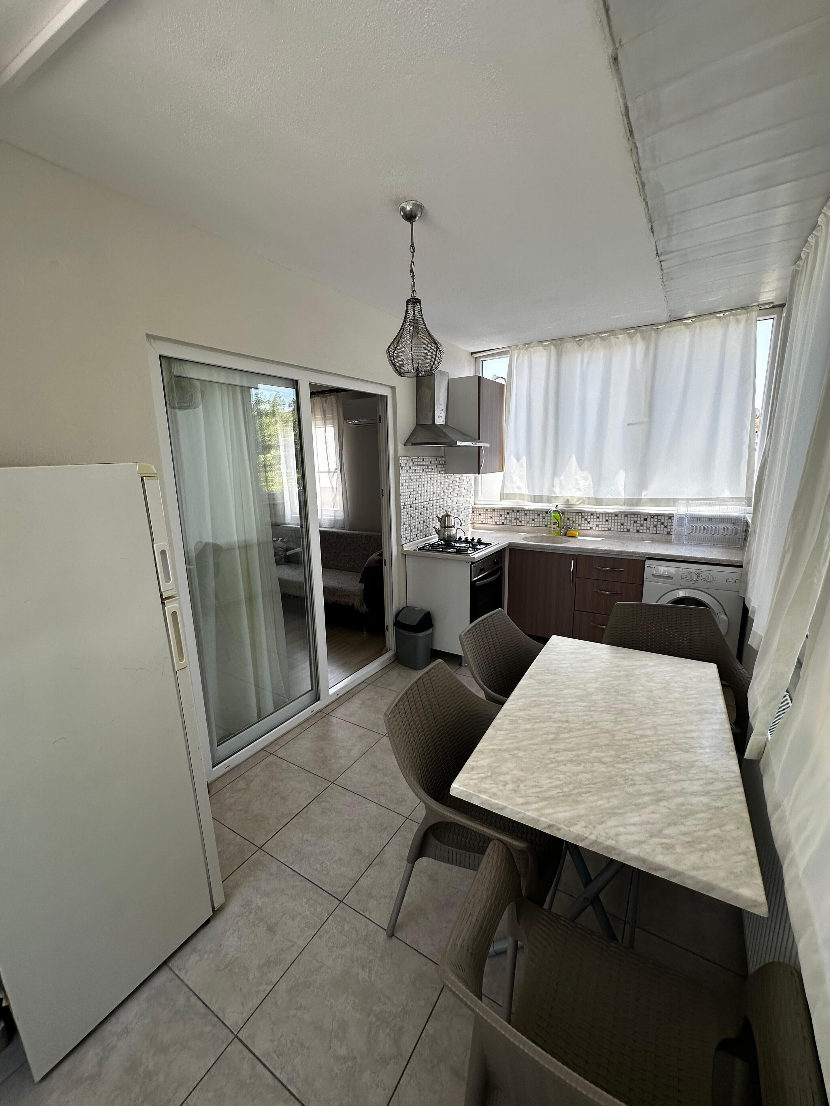 Standard Apartment, City View | Private kitchen | Fridge