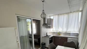 Standard Apartment, City View | Private kitchen | Fridge