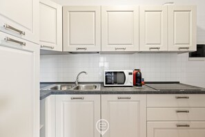 Fridge, microwave, dishwasher, dining tables