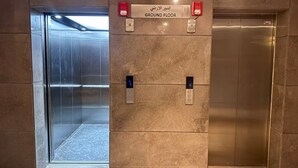 An elevator with a sign indicating the ground floor. - Apartment 2 in Zed Towers (El Sheikh Zayed City)