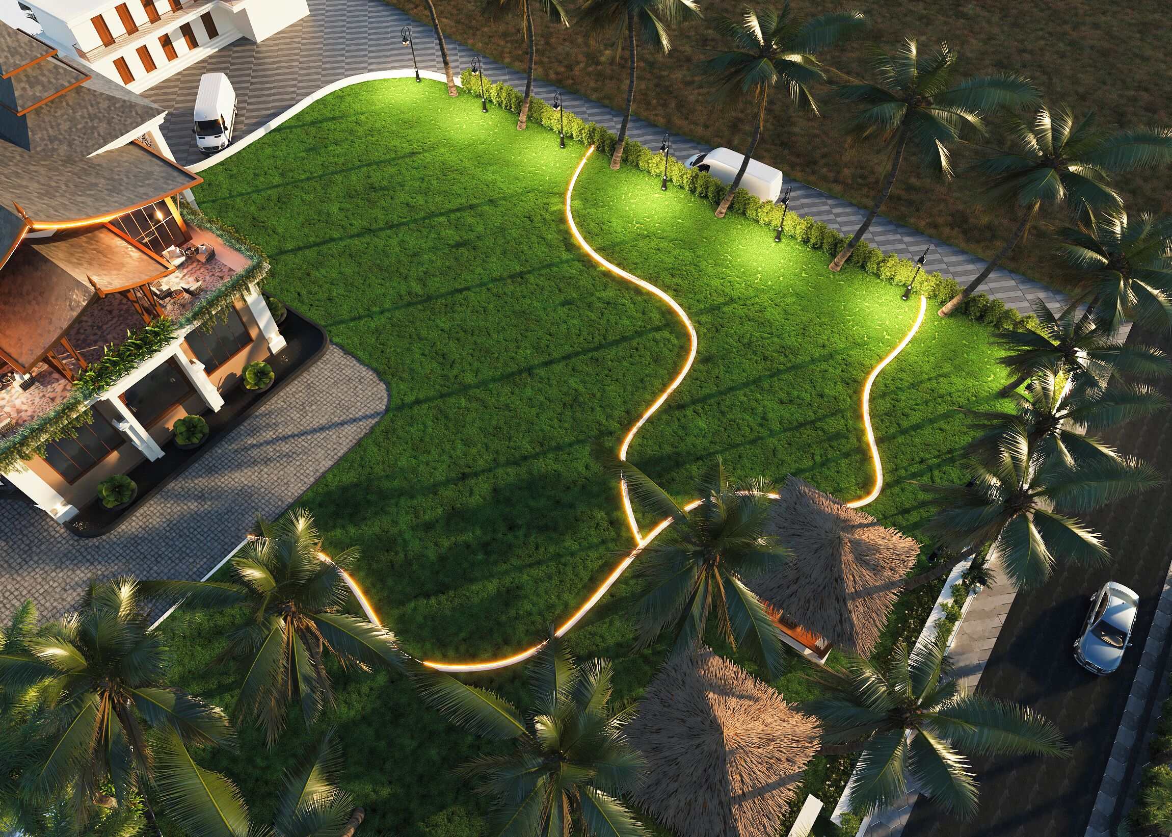 A modern building with a well-maintained lawn, palm trees, and a paved driveway.