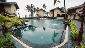 Outdoor pool, open 7:00 AM to 7:00 PM, sun loungers, lifeguards on site