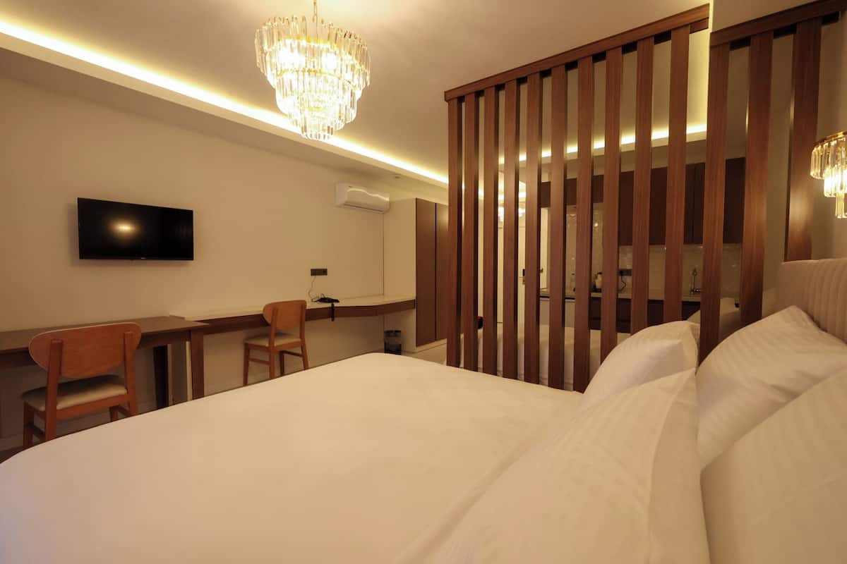 Family Twin Room, City View | In-room safe, desk, laptop workspace, blackout drapes