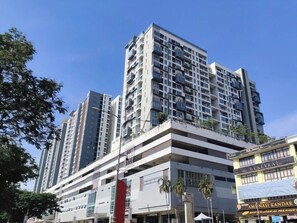 A multi-story building with a modern architectural design, featuring balconies and large windows. - Zetapark Condominium by Emily in Town (Kuala Lumpur)