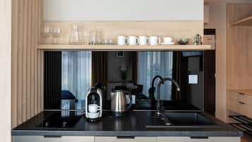 Oven, dishwasher, coffee/tea maker, cookware/dishes/utensils