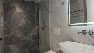 Deluxe Double Room, Balcony, Beach View | Bathroom | Shower, hair dryer, towels, soap