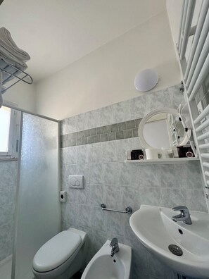 Twin Room, Beach View | Bathroom | Shower, hair dryer, towels, soap