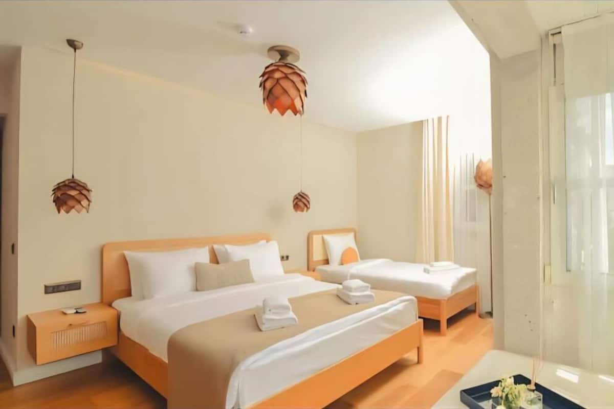 Deluxe Quadruple Room, City View | Desk, laptop workspace, WiFi (free)