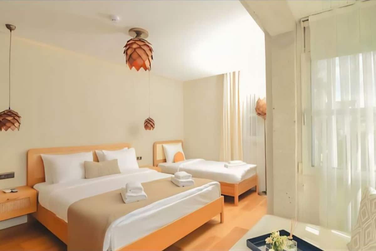 Deluxe Quadruple Room, City View | Desk, laptop workspace, free WiFi
