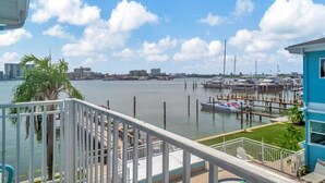 A marina with boats docked, a clear sky, and a view of the city skyline. - Resort Condo just 2 Blocks from Clearwater Beach! (Clearwater)