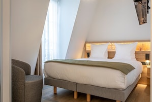 Premium bedding, desk, laptop workspace, free WiFi