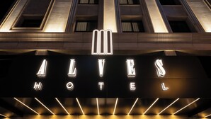 A hotel sign with illuminated letters spelling "ALVES HOTEL". - ALVES HOTEL (İzmir)