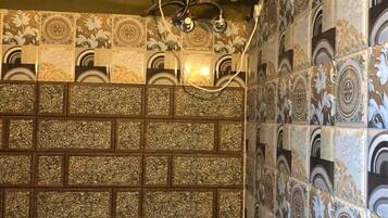 Separate tub and shower, slippers, towels, soap