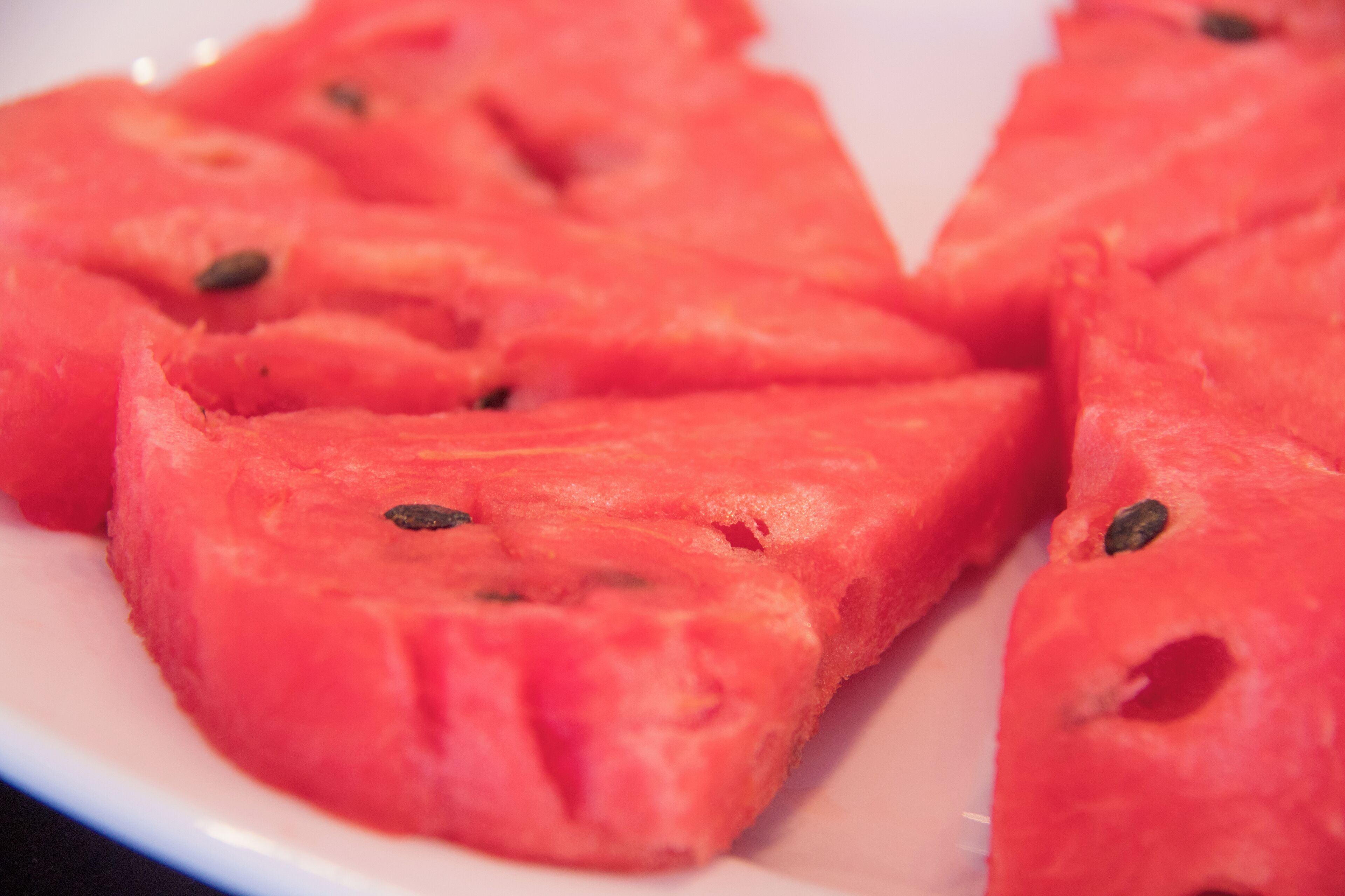 A close-up of watermelon slices on a plate.