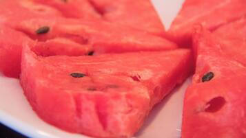 A close-up of watermelon slices on a plate.