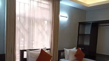 Deluxe Triple Room, Balcony, Garden View | Individually decorated, desk, laptop workspace, blackout drapes