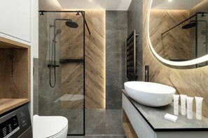 Shower, hair dryer, towels, shampoo