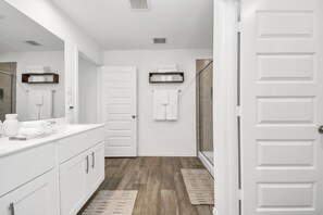 Shower, hair dryer, towels, soap