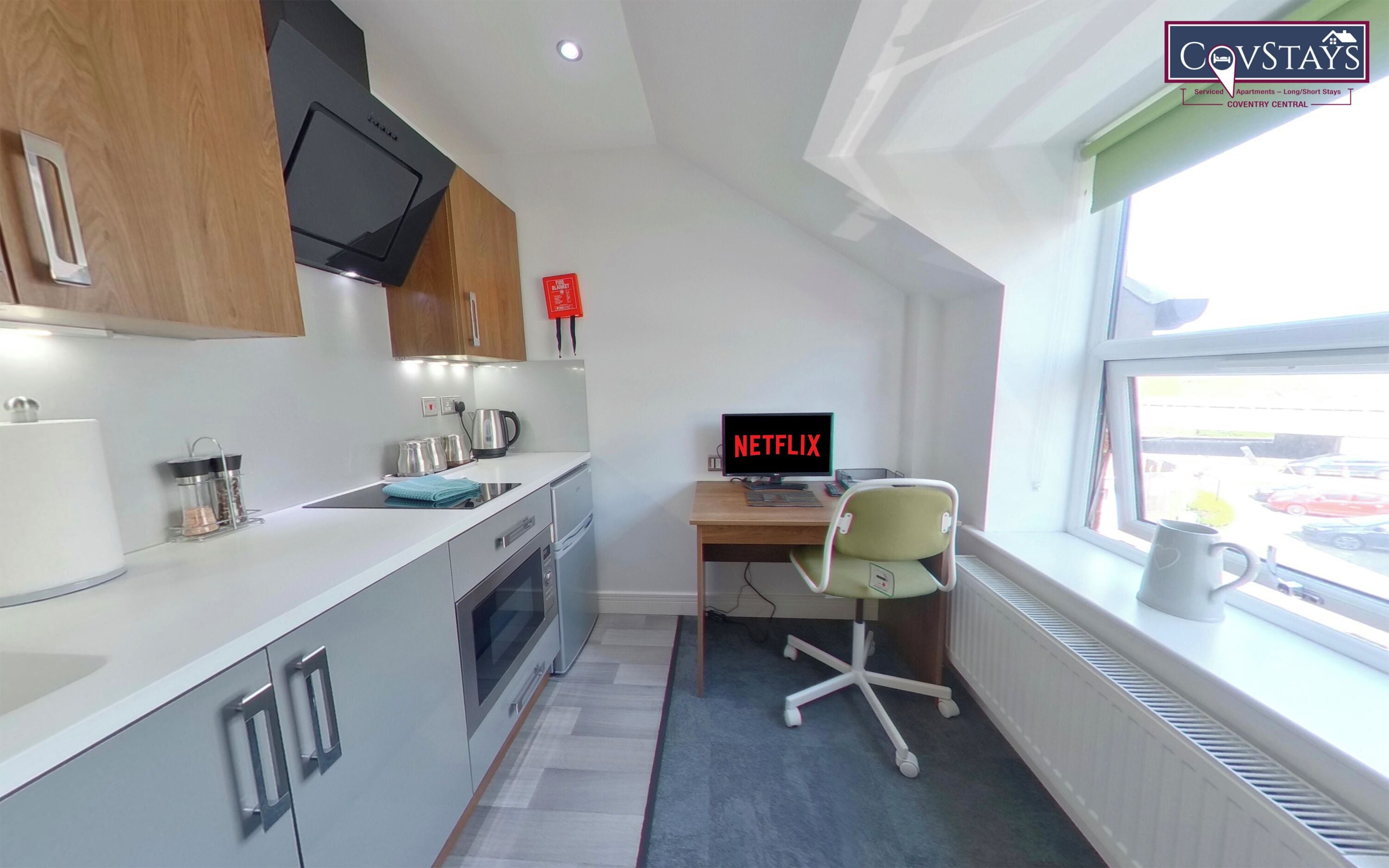 Premium bedding, down comforters, desk, laptop workspace