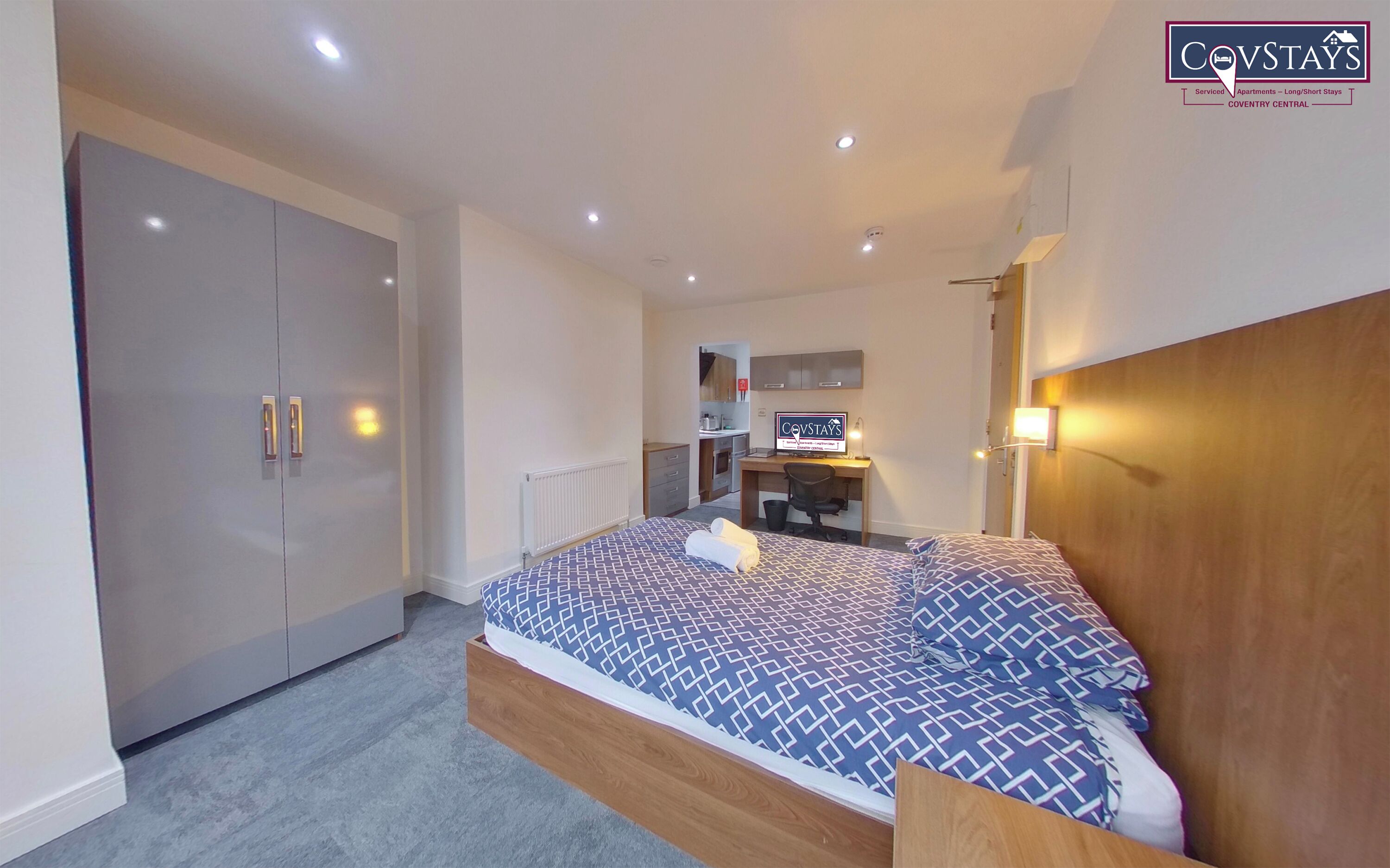 Premium bedding, down comforters, desk, laptop workspace