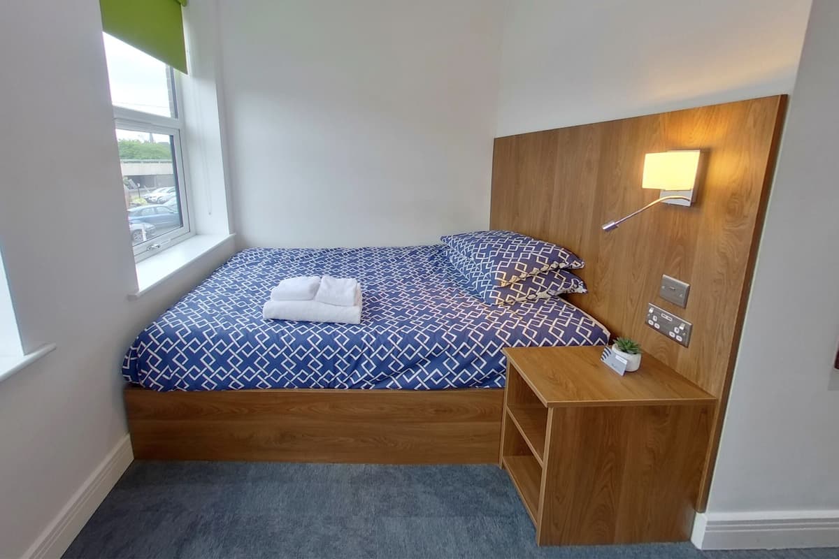 Standard Studio | Premium bedding, down comforters, desk, laptop workspace