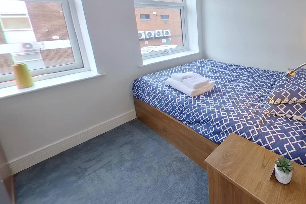 Premium bedding, down duvets, desk, laptop workspace