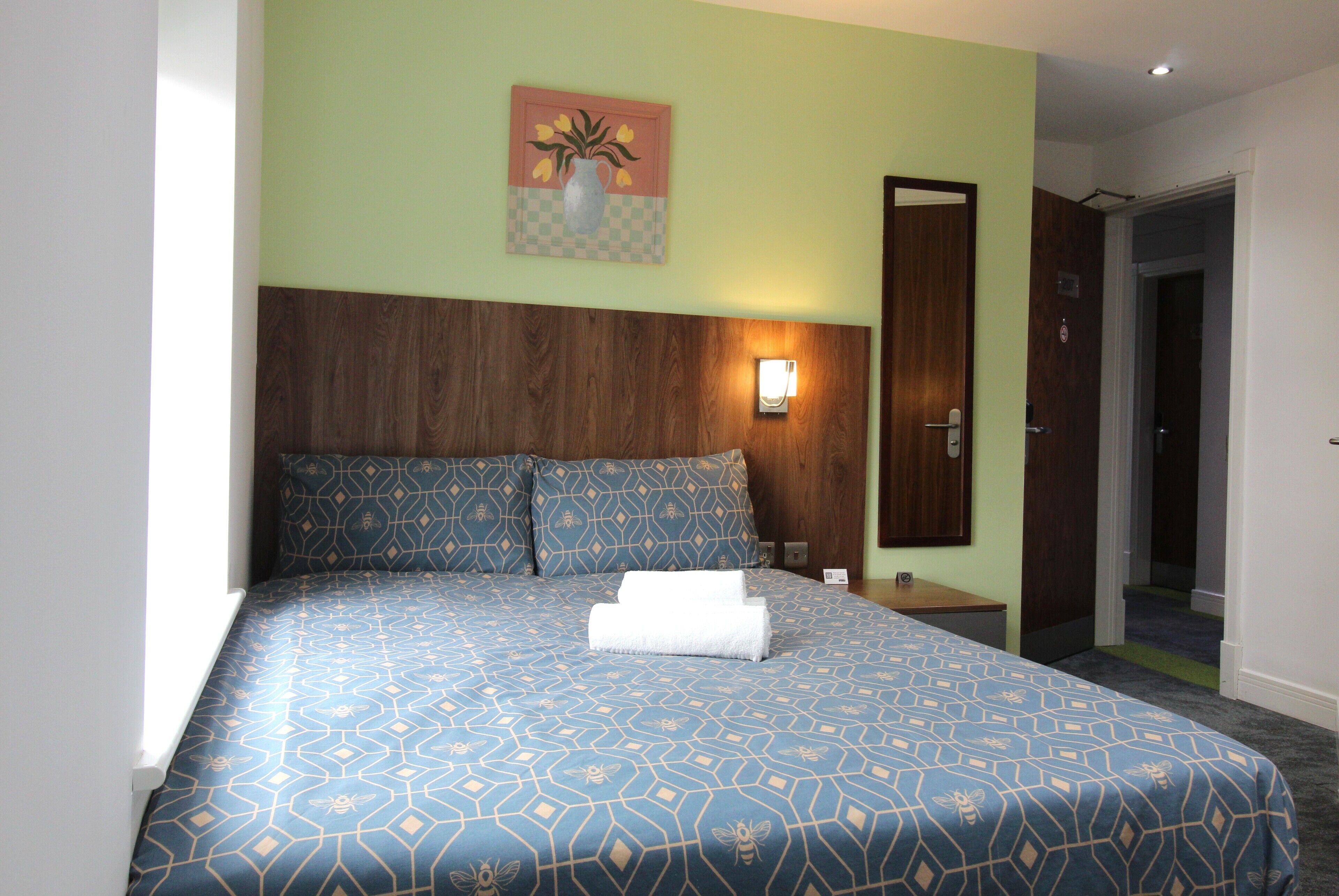 Premium bedding, down comforters, desk, laptop workspace