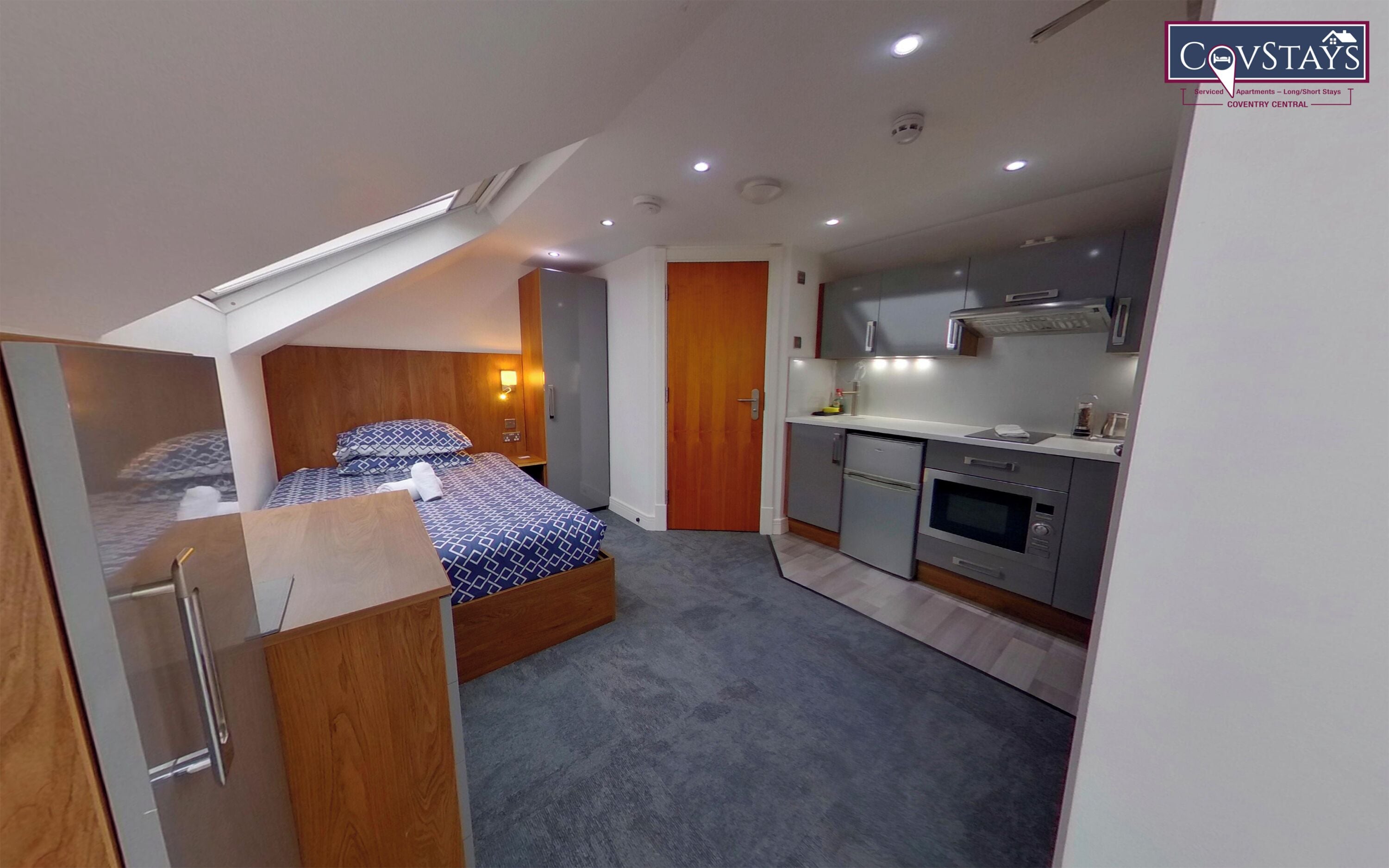 Premium bedding, down comforters, desk, laptop workspace