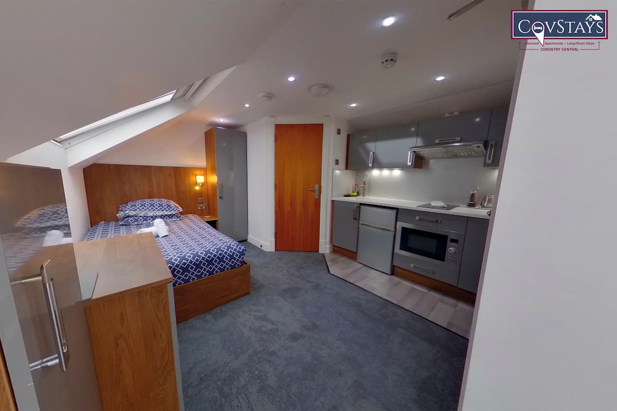 Premium bedding, down comforters, desk, laptop workspace